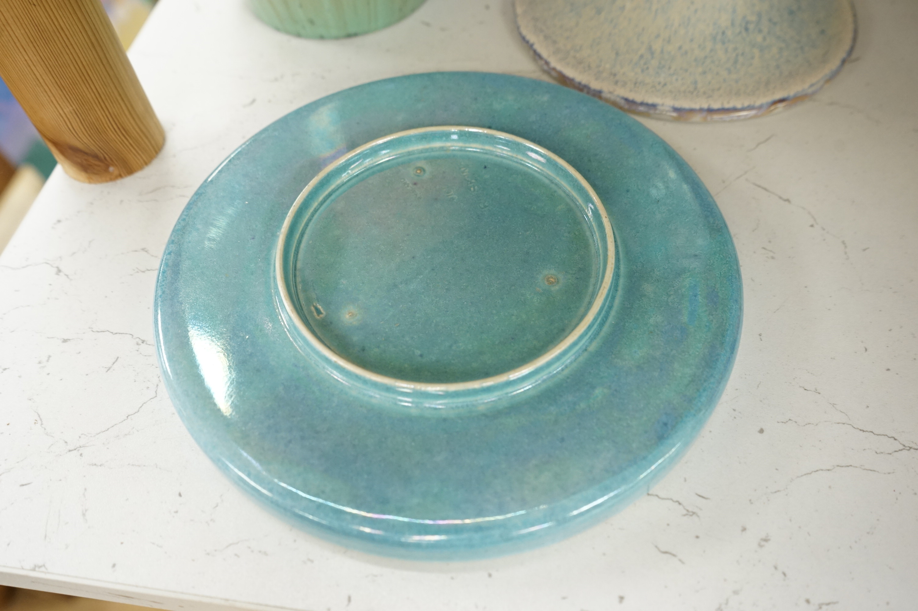 A Ruskin souffle glazed vase, impressed 1932, a Ruskin circular dish and an earthenware candlestick, tallest 21cm (3)